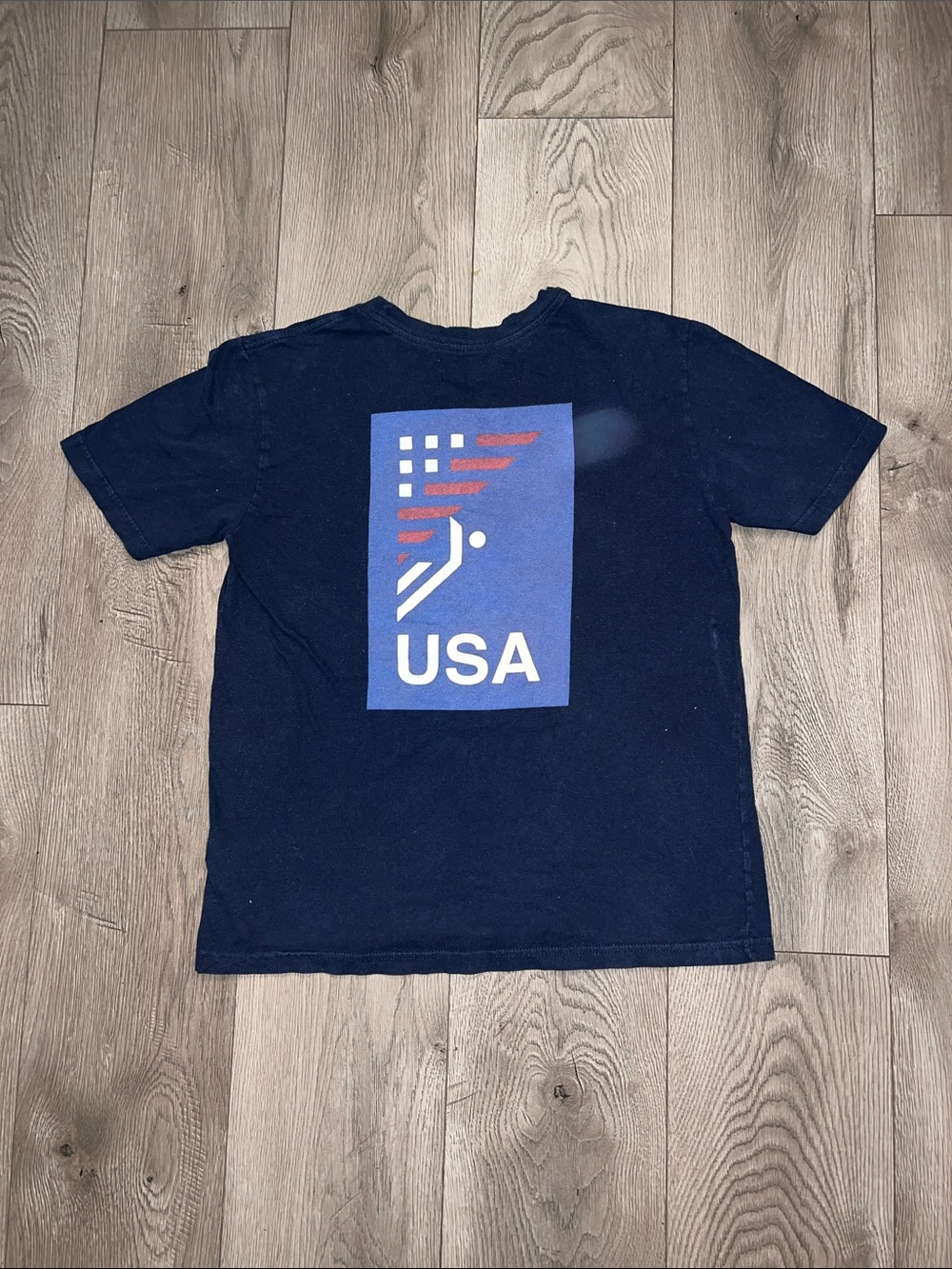 The North Face. USA Graphic Navy Tee with Flag Motif.